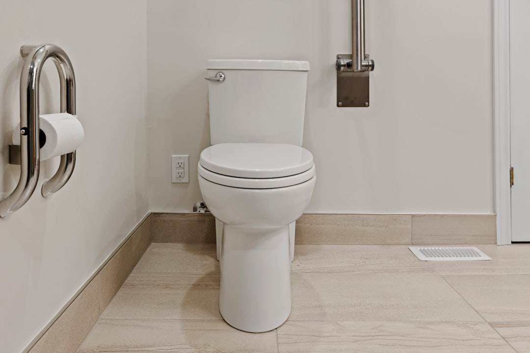 Clean white bathroom toilet in Singapore home showing good hygiene